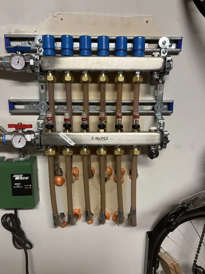 Plumber performing Gas Line Installation at a residential property in Dillonvale